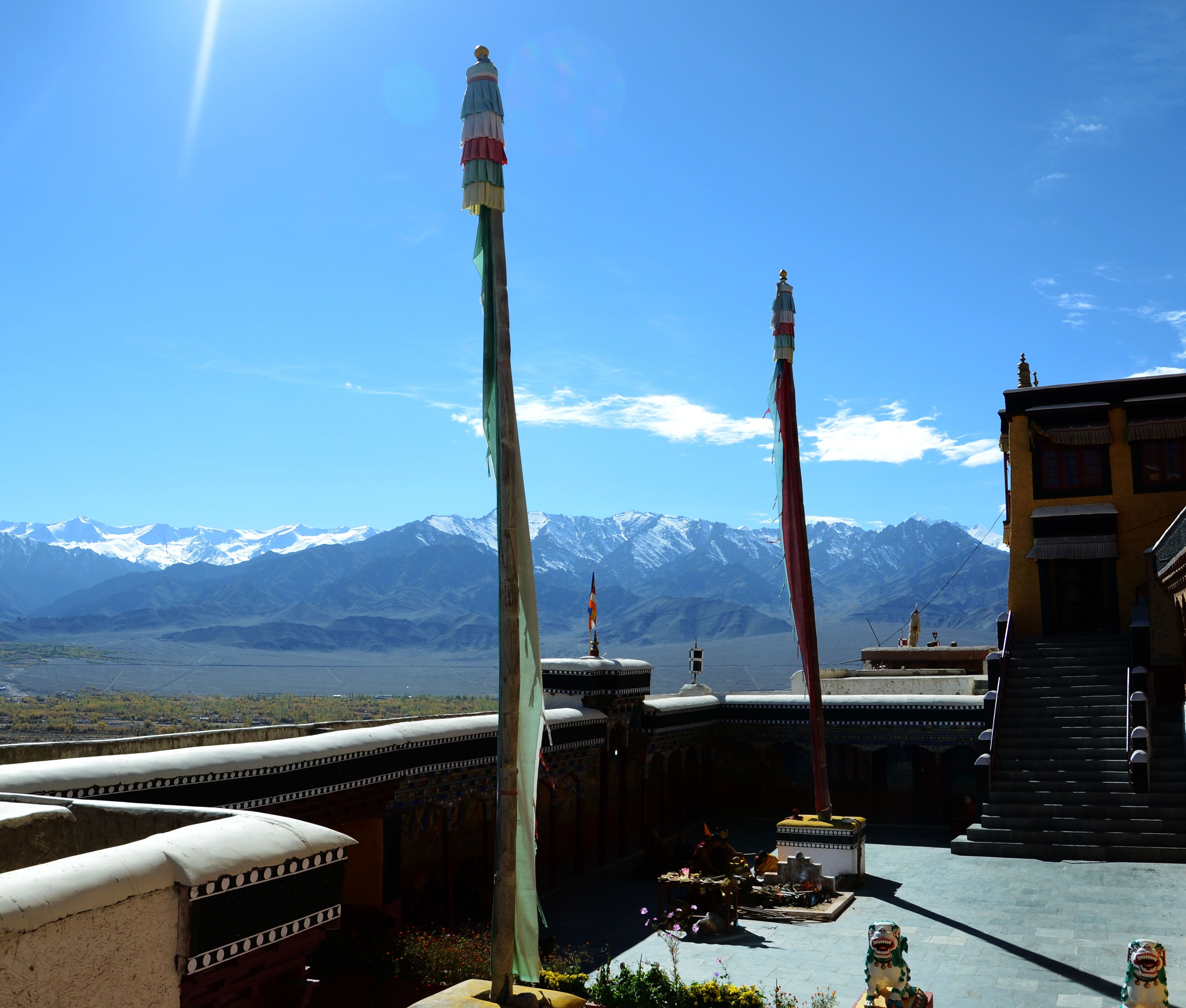 Prayer banners and mountain views from the courtyard of Thiksey Monastery in Ladakh
