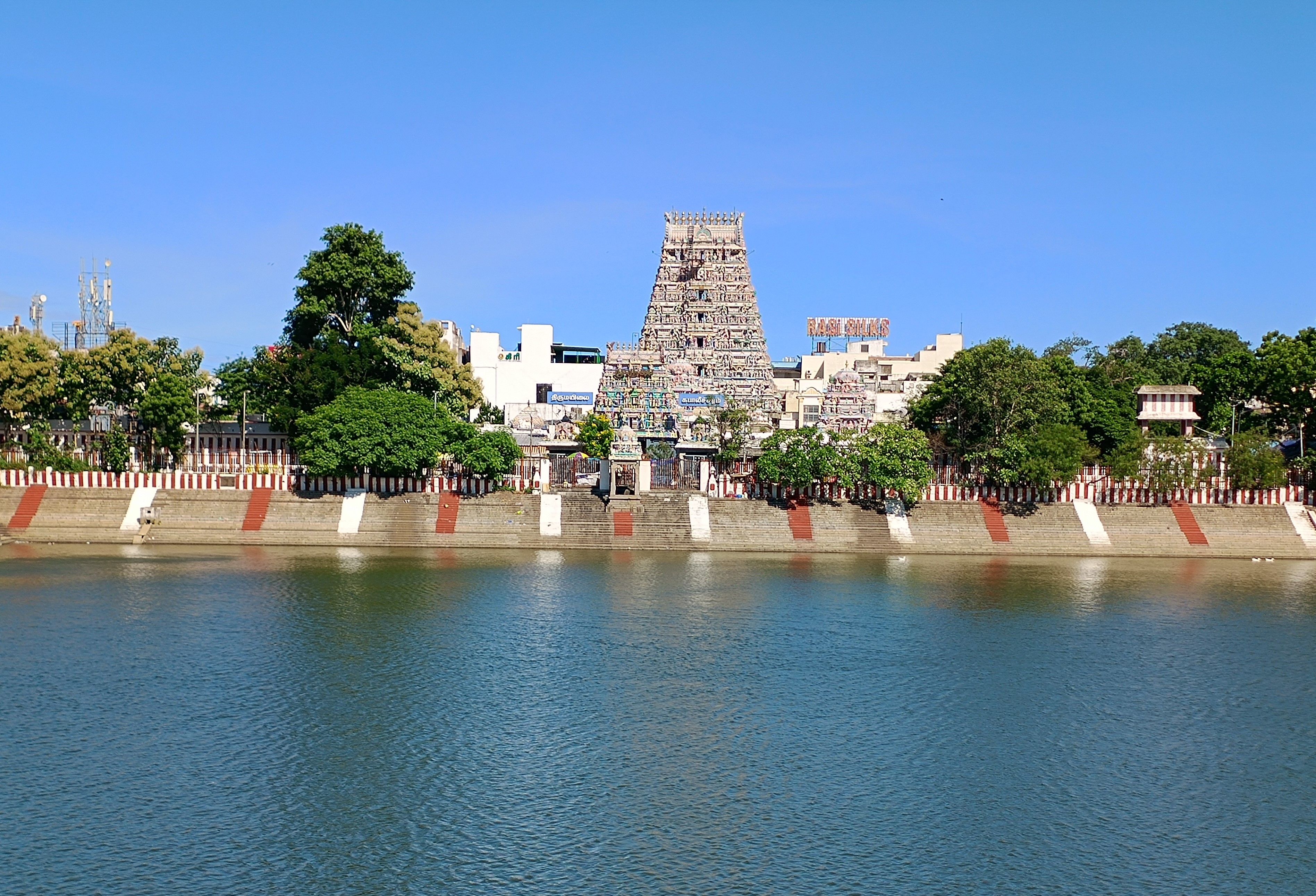 Kapaleeshwarar Temple in Mylapore seen across its blue temple tank in Chennai