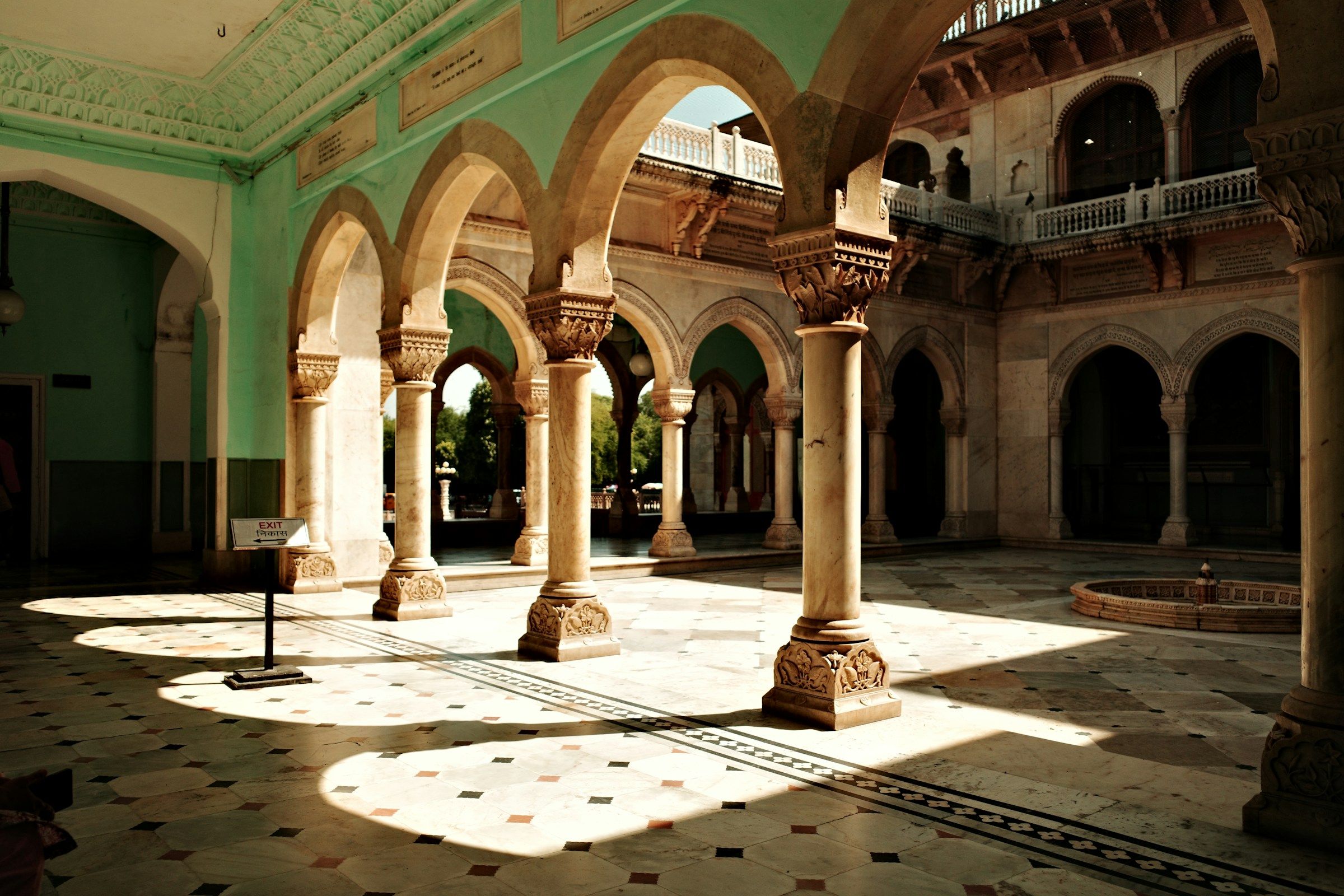 Sunlight falling across carved columns and arches at Albert Hall Museum in Jaipur