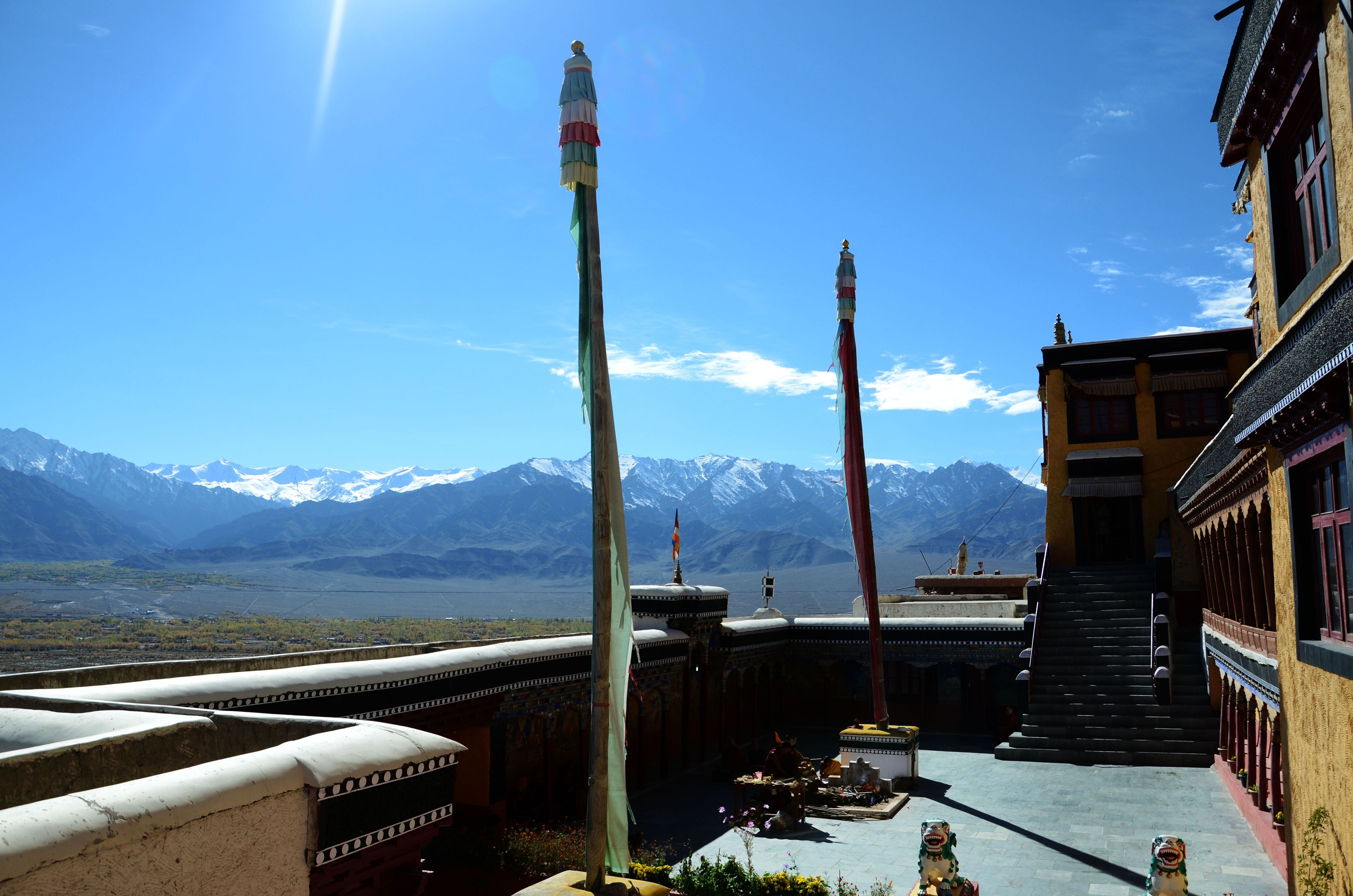 Prayer banners and mountain views from the courtyard of Thiksey Monastery in Ladakh