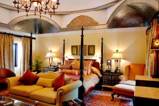 A heritage hotel bedroom with a four-poster bed