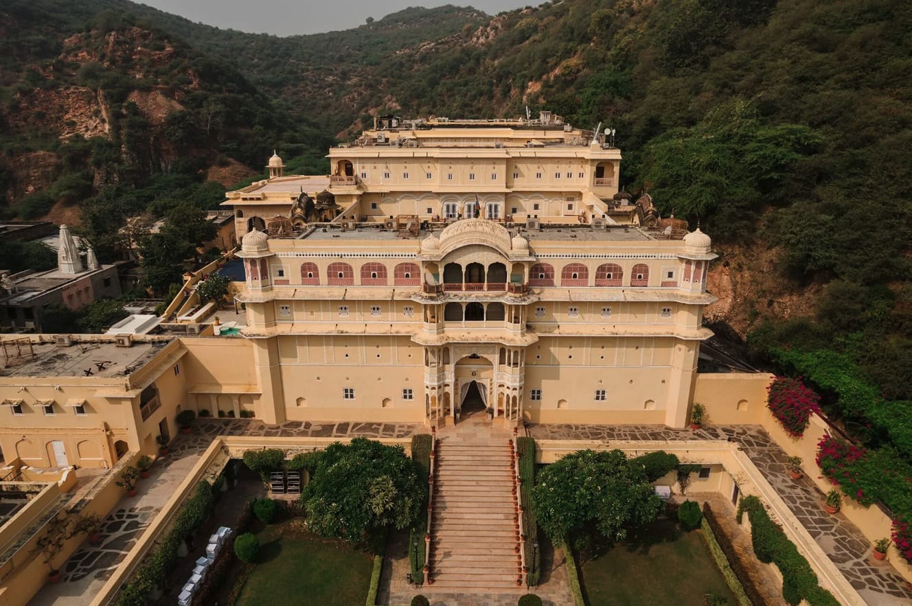 A hilltop palace approached by a long formal stairway