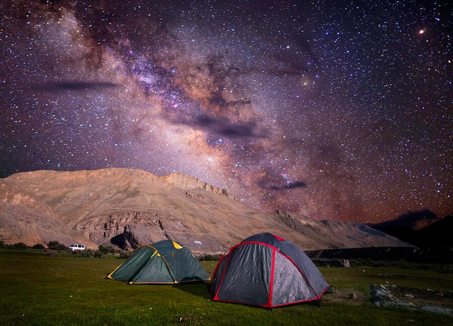 Tents beneath a star-filled night sky