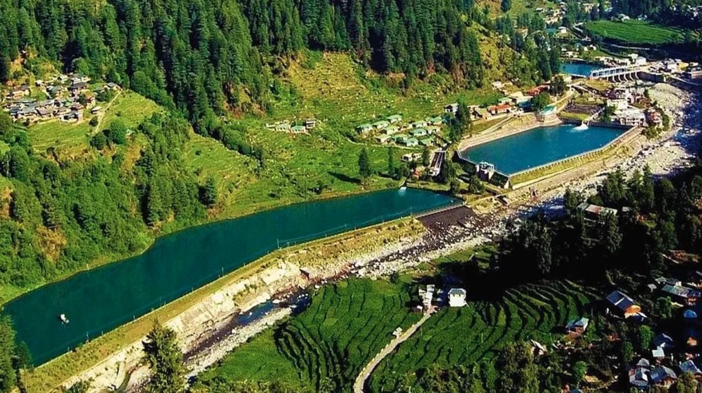 Aerial view of a river and mountain village