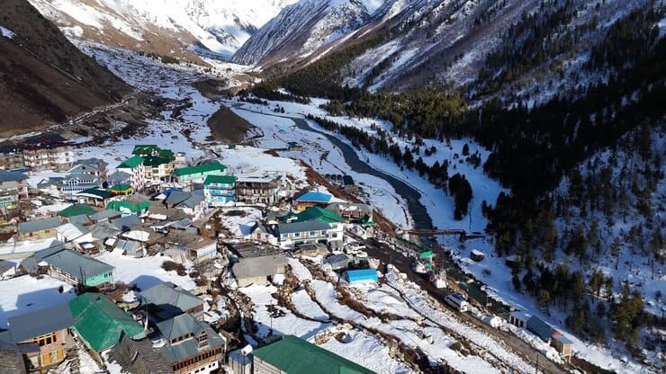 A snow-covered village beside a winding river