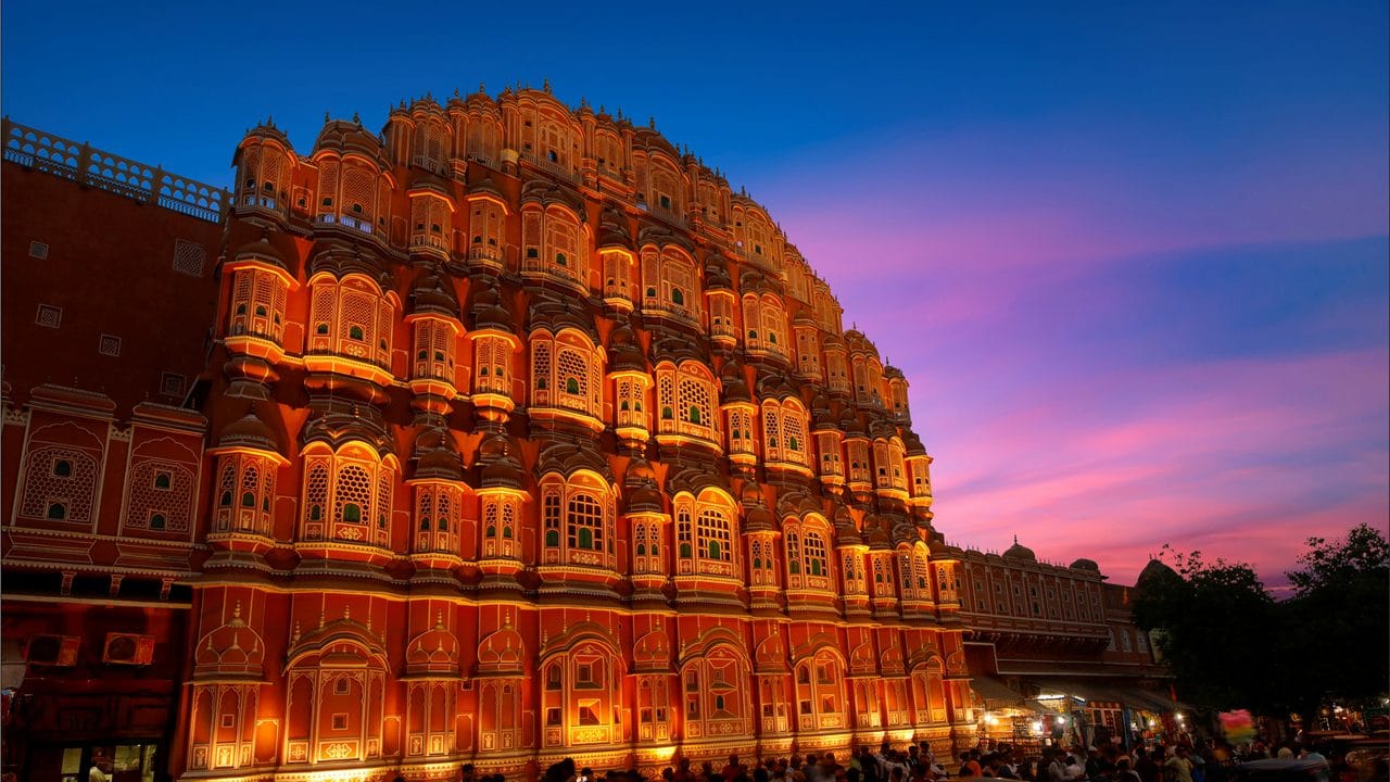 Jaipur's Hawa Mahal illuminated beneath a twilight sky