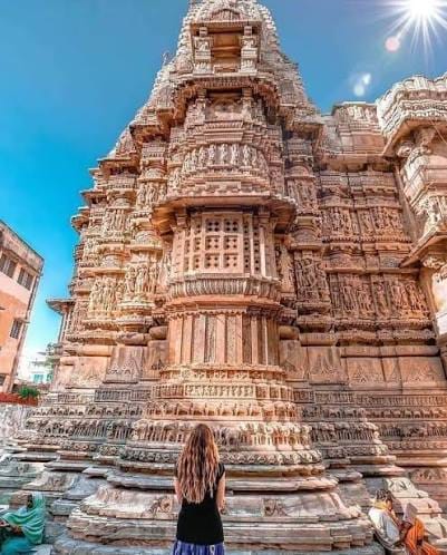 A carved stone temple tower rising above steps