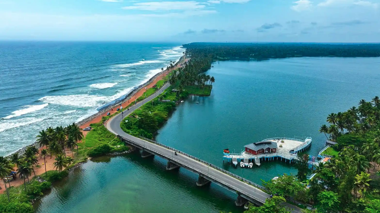 A narrow coastal road between the sea and a lagoon