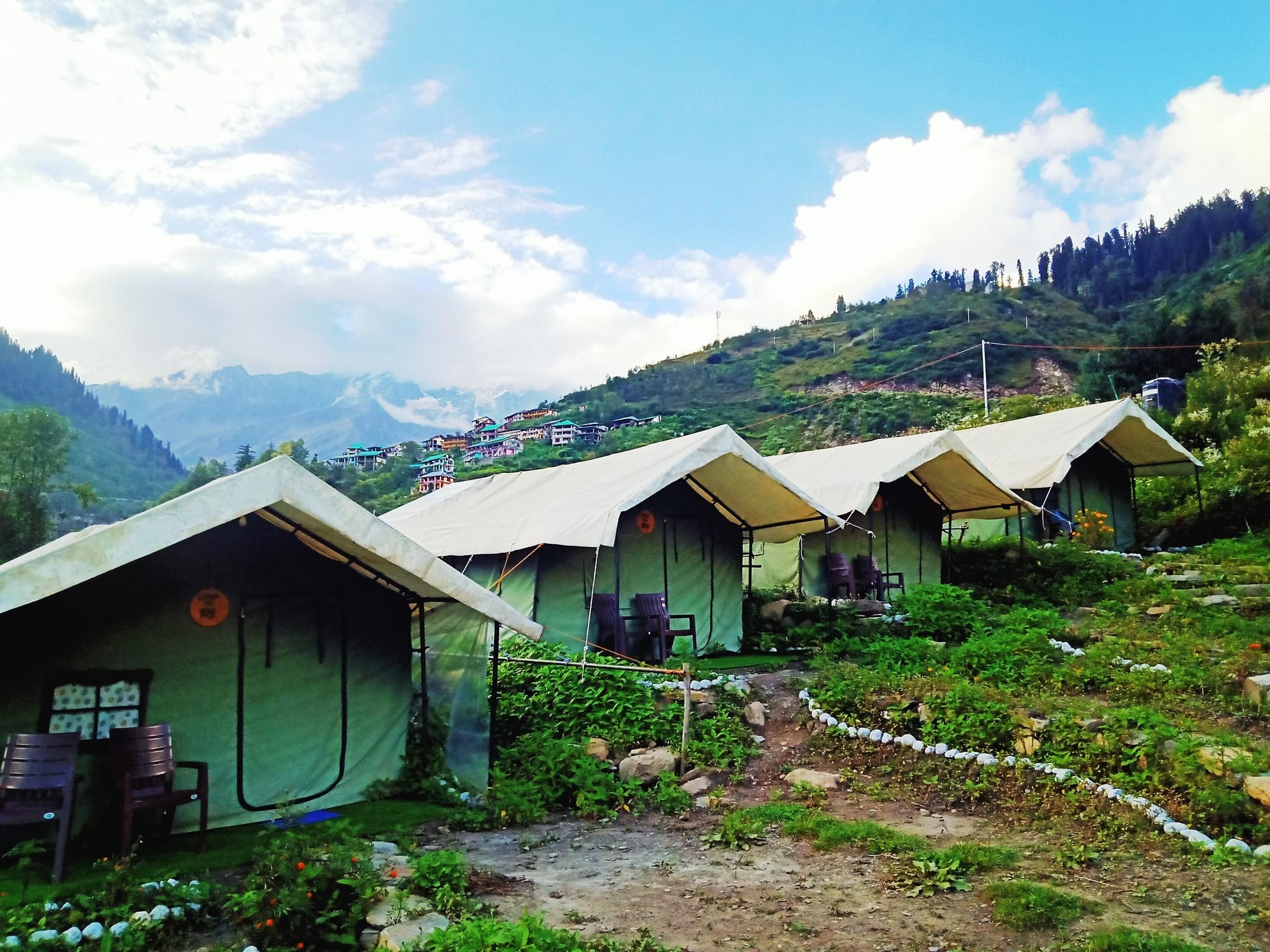 Tent cabins facing a mountain valley
