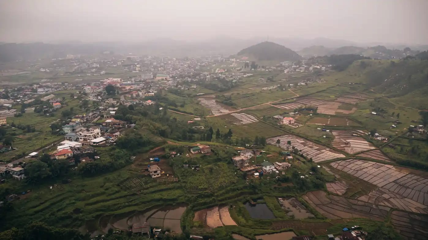 A town and agricultural fields spread across a valley