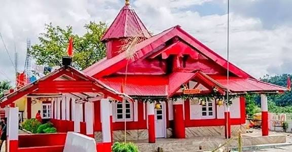 A red and white church with steep roofs