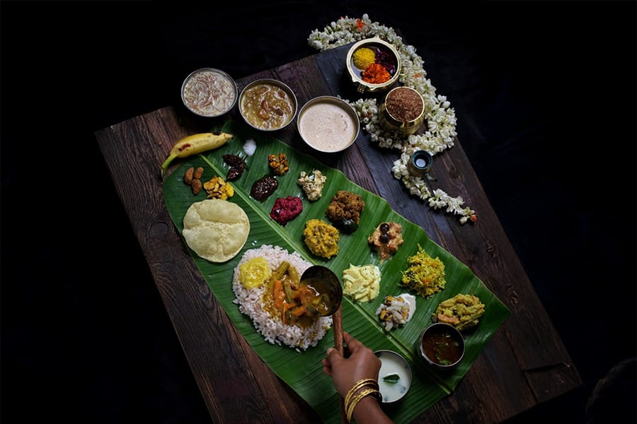 A Kerala meal served on a banana leaf with several side dishes