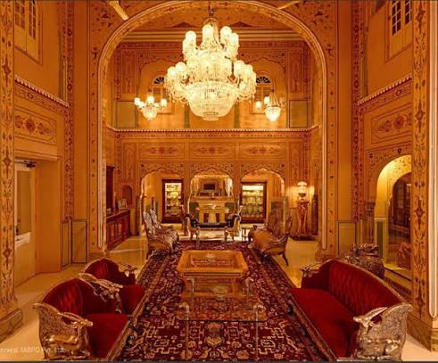 A chandelier above a richly decorated sitting room