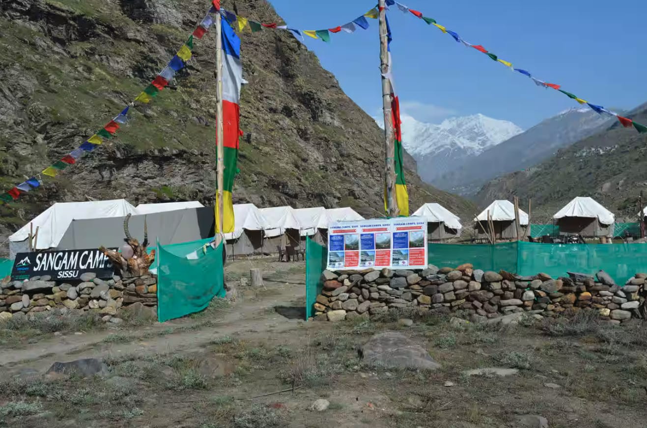 Prayer flags above the entrance to a mountain campsite
