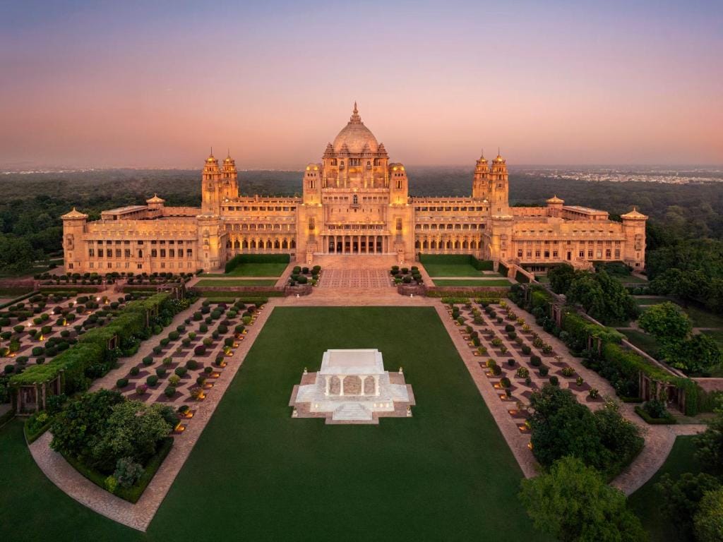 Umaid Bhawan Palace and its formal gardens at dusk